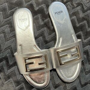 Brand new, never worn silver slides. So cute for summer!